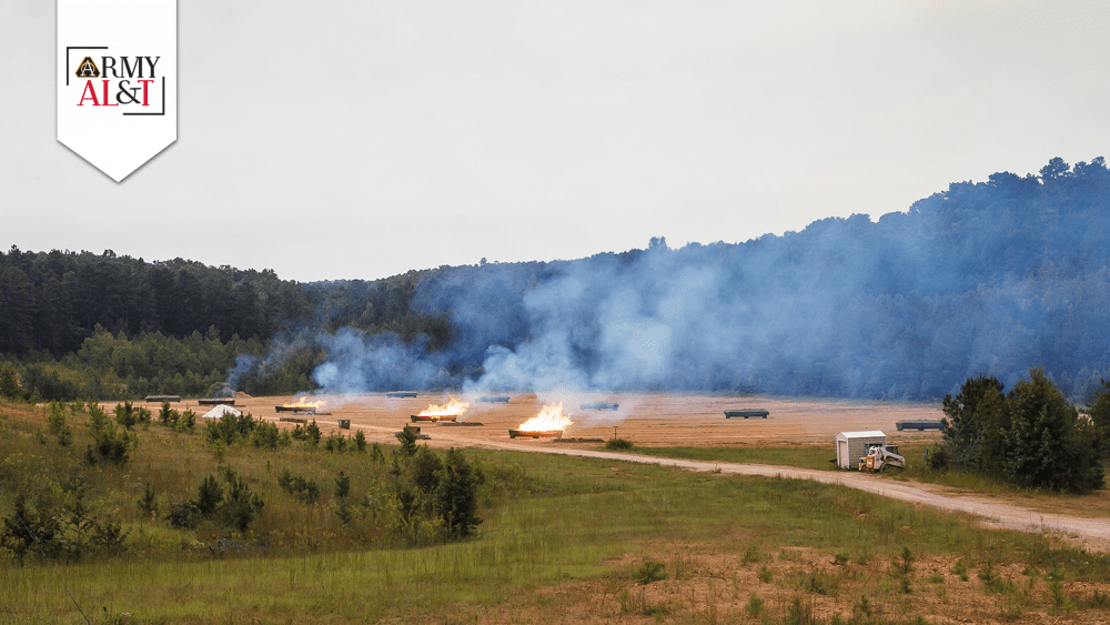 Inoperable ammunition being burned in an outdoor field.