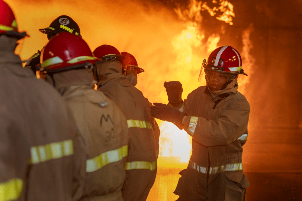 Servicemembers fight a fire under supervision