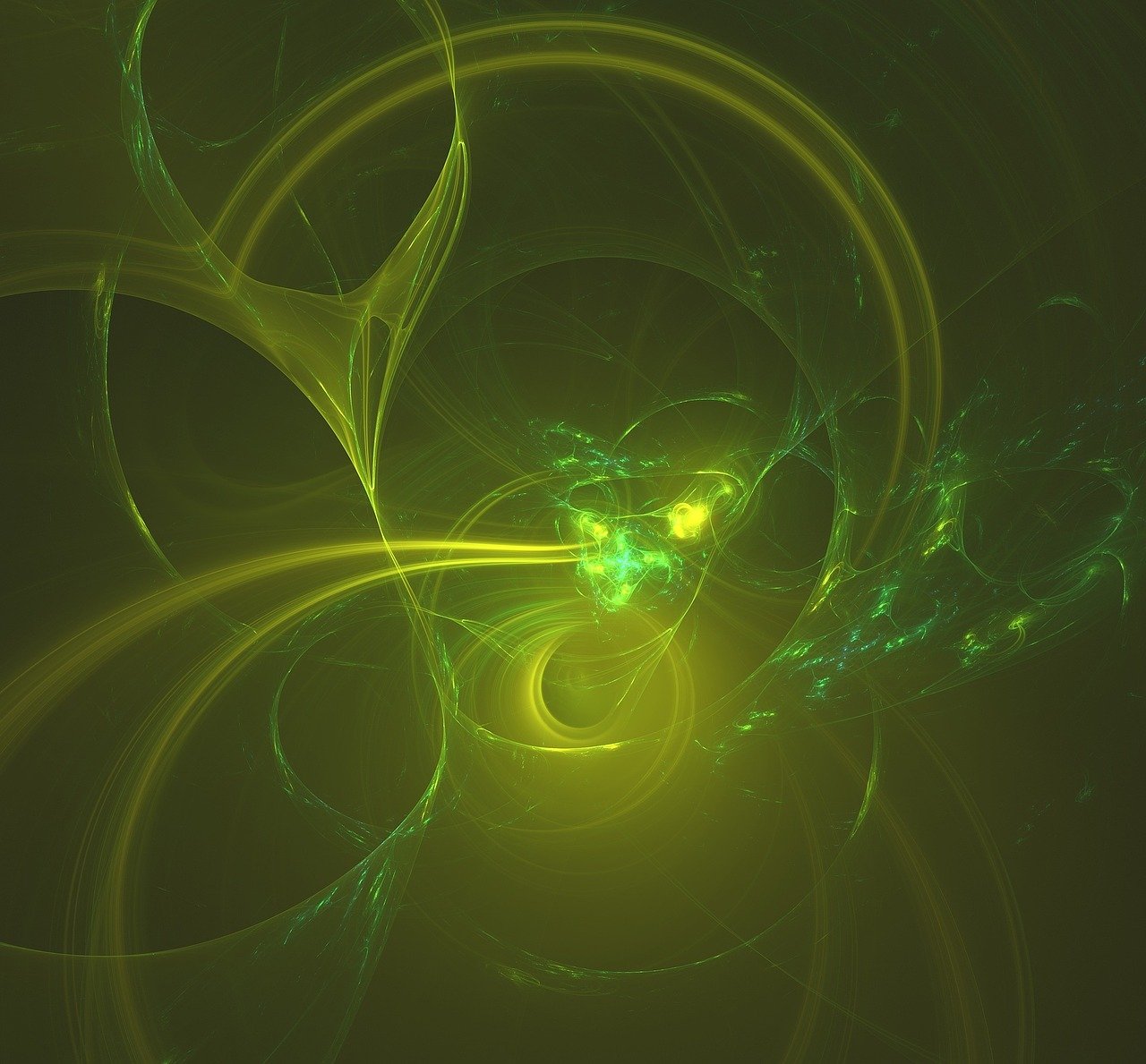 The image is of a green and yellow cloud or particles swirling on a black background.