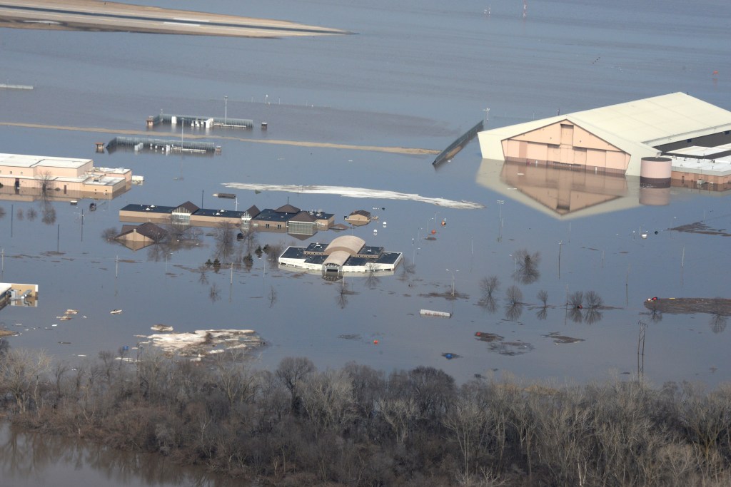 Many buildings which are partially submerged by flood waters.
