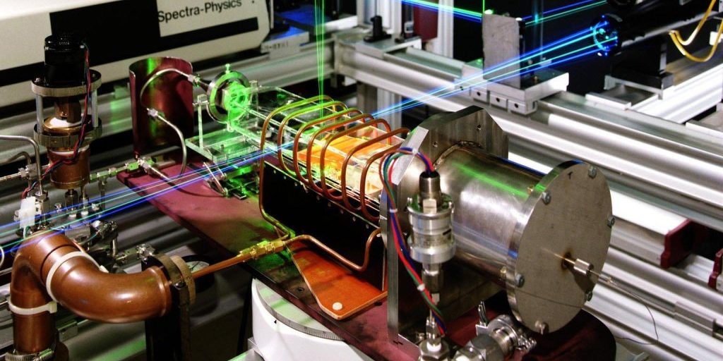 Laser velocimetry (LV) is being used to measure the gas flows in chemical vapor deposition (CVD) reactors. These gas flow measurements can be used to improve industrial processes in semiconductor and optical layer deposition and to validate numerical models. Visible in the center of the picture is the graphite susceptor glowing orange-hot at 600 degrees C. It is inductively heated via the copper cool surrounding the glass reactor.

NASA Identifier: L93-11690