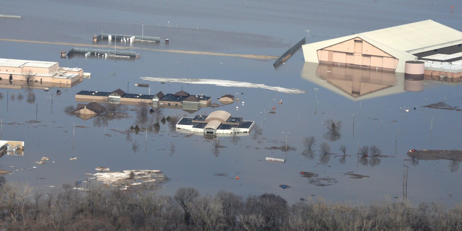 190317-F-IT794-1054 Many buildings which are partially submerged by flood waters.