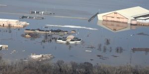 Many buildings which are partially submerged by flood waters.