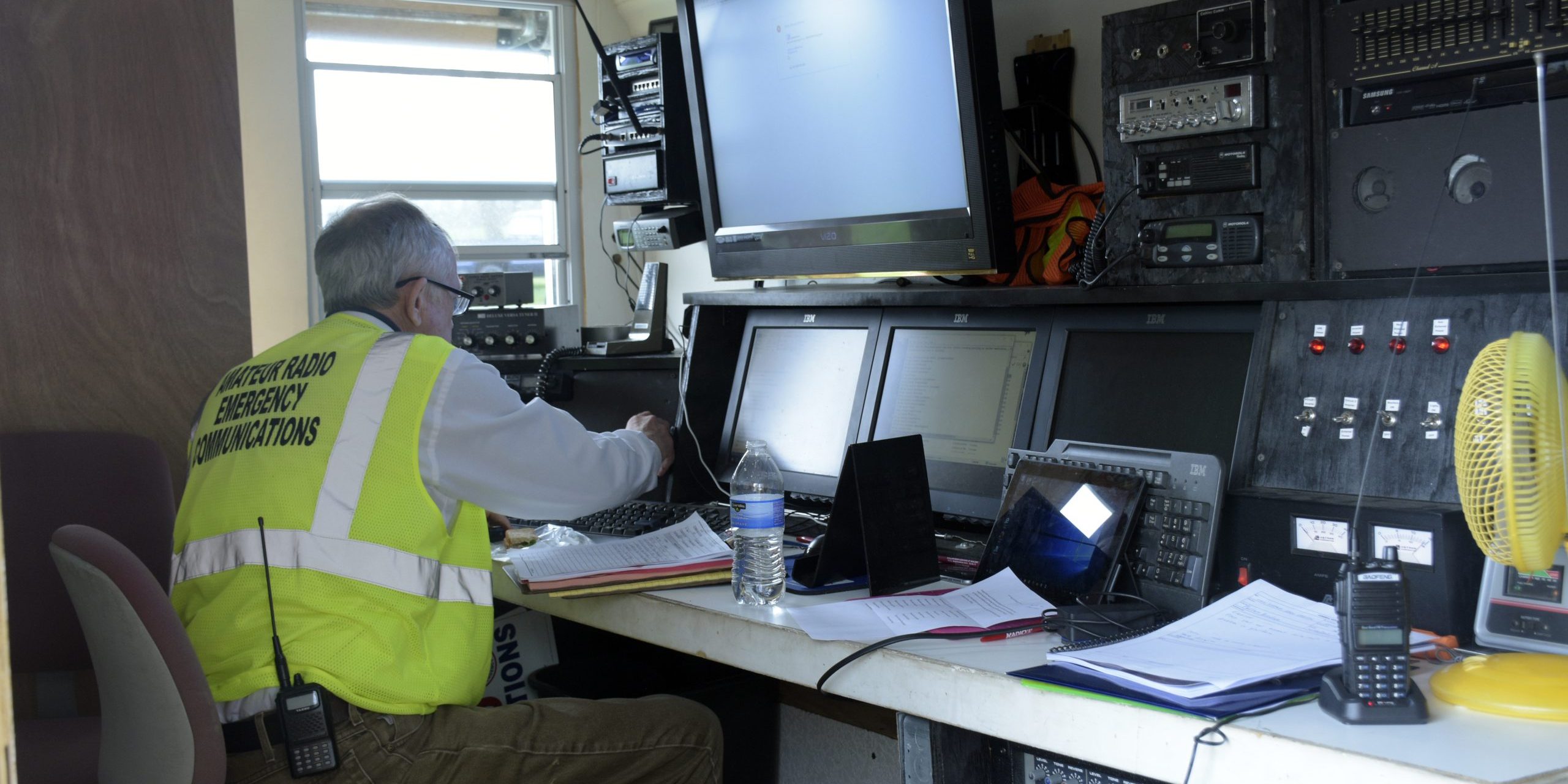 A volunteer with the Wisconsin Amateur Radio Emergency Service/Radio Amateur Civil Emergency Service monitors communication during the State Interoperable Mobile Communications Exercise in Sauk County, WI, on April 25-27, 2017. SIMCOM is an annual exercise designed to educate, coordinate, and test Mobile Emergency Communications platform capabilities from federal, state, tribal, and local emergency response agencies (Wisconsin National Guard photo by Sgt. Katie Eggers).