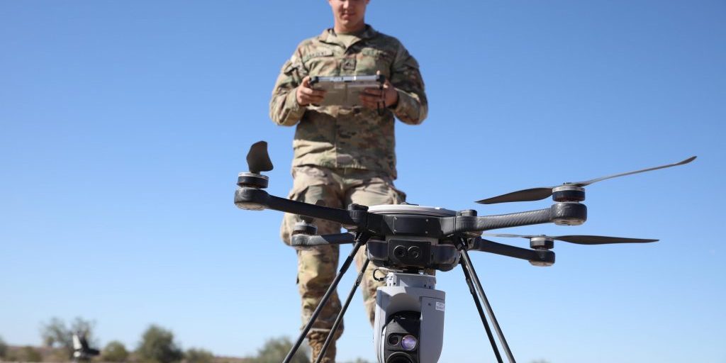 U.S. Army PFC Benjamin Sargent, assigned to 82nd Airborne Division, prepares a multimission payload unmanned aerial system (UAS) for launch during Project Convergence at Yuma Proving Ground, AZ, on October 26, 2021. During PC21, soldiers are experimenting with ways to use UASs to help them see on the battlefield. Project Convergence is the Army's campaign of learning designed to aggressively advance and integrate our Army's contributions, based on a continuous structured series of demonstrations and experiments throughout the year. It ensures that the Army is part of the joint fight and can rapidly and continuously integrate or converge effects across all domains -air, land, sea, space, and cyberspace - to overmatch our adversaries in competition and conflict. Project Convergence ensures the Army has the right people with the right systems, properly enabled in the right places to support the joint fight (U.S. Army photo by Sgt. Marita Schwab).