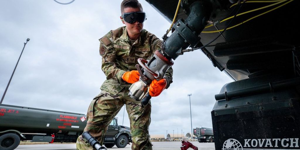 Tech. Sgt. Collin Stratton, 96th Logistics Readiness Squadron, secures his single-point nozzle adapter to an R-11 fuel truck Nov. 6, 2024 at Eglin Air Force Base, Florida. The SN adapter, an innovation created by Stratton, makes fuel sampling easier and safer by reducing the steps required to gain the sample. Fuel samples are taken to ensure aircraft fuel is free of water and other contaminants. (U.S. Air Force photo by Samuel King.)