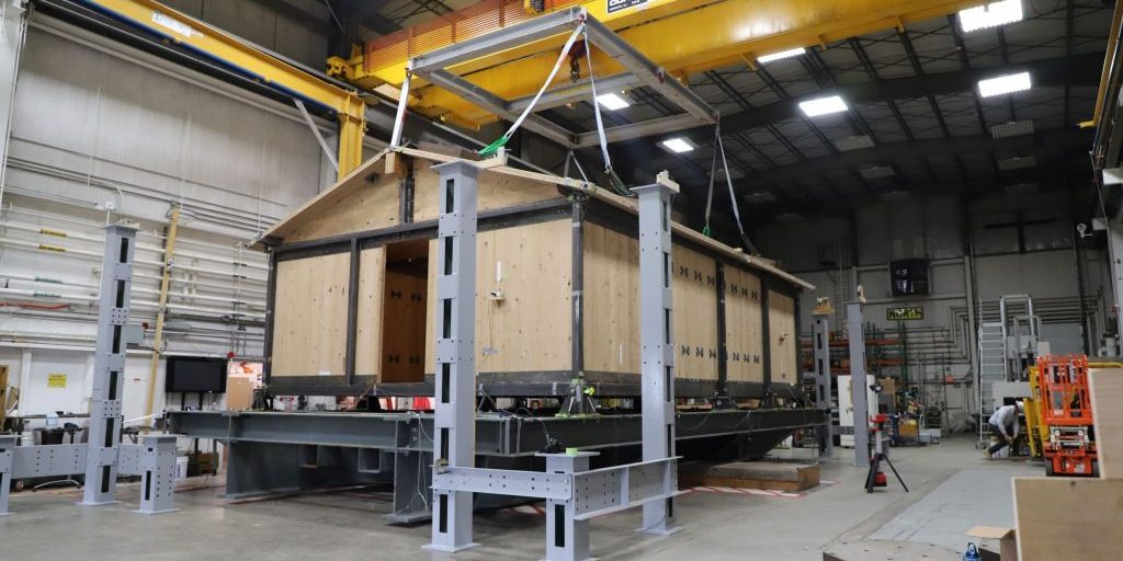 The 600-square-foot Cross Laminated Timber shelter on the Triaxial Earthquake and Shock Simulator at ERDC's Construction Engineering Research Laboratory (CERL)