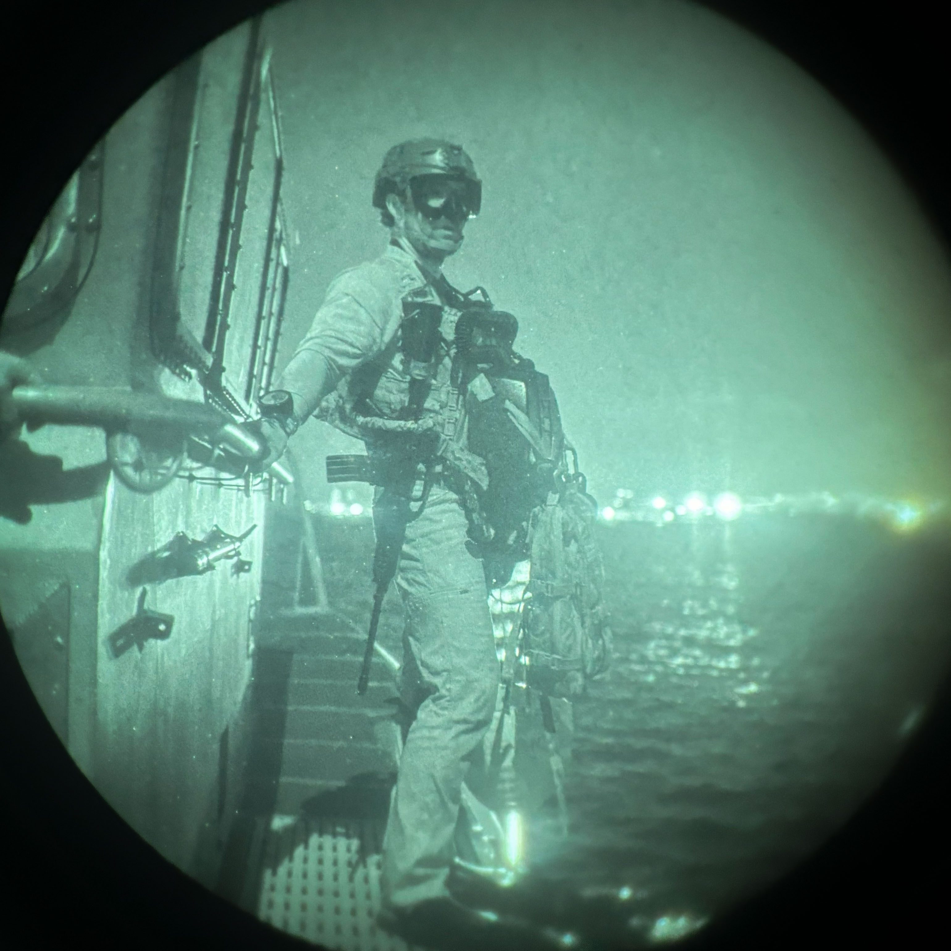 infrared picture of U.S. Army soldier standing on a U.S. Coast Guard boat