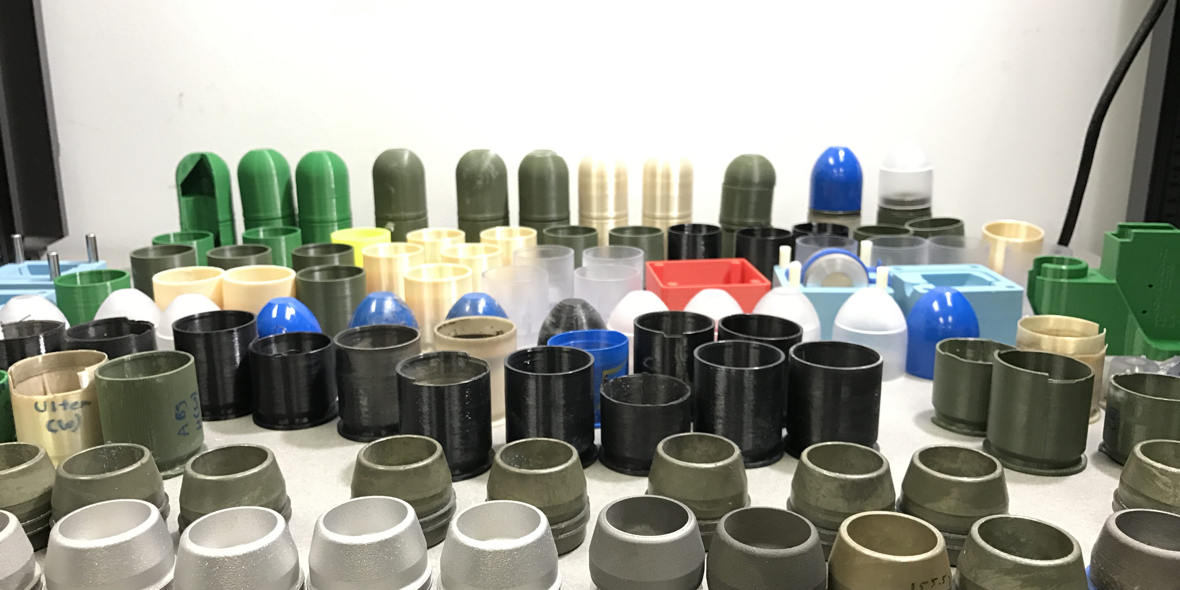 Fig17_M781Comp These M781 components were 3D-printed during a six-month collaborative effort that involved RDECOM, ManTech and America Makes, the national accelerator for additive manufacturing and 3D printing. They cost tens of thousands of dollars less than identical components created with standard production methods. (U.S. Army photo by Sunny Burns, ARDEC)