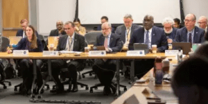 S&T Under Secretary Dr. Dimitri Kusnezov and several colleagues sitting at a conference.