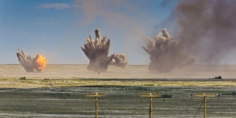 Image of multiple explosions on a range