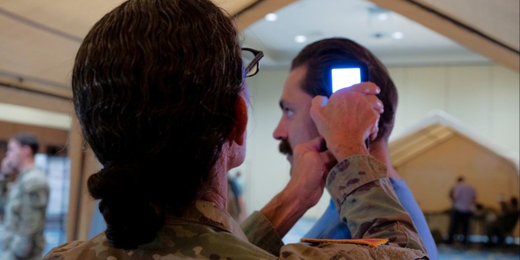 U.S. Army Lt. Col. Wendra Galfand, the Director of Medical Education and Research at Womack Army Medical Center, operates an intercranial hemorrhage assessment device during a Soldier touchpoint event, Fort Liberty, N.C., Sept. 18, 2024. During the touchpoint, advanced developers with the U.S. Army Medical Materiel Development Activity and the North Carolina Center for Optimizing Military Performance gathered performance feedback from Soldiers employing two brain trauma assessment devices currently under development at USAMMDA. USAMMDA develops, delivers, and fields critical drugs, vaccines, biologics, devices, and medical support equipment to protect and preserve the lives of Warfighters across the globe. USAMMDA Project Managers guide the development of medical products for the U.S. Army Medical Department, other U.S. military services, the Joint Staff, the Defense Health Agency, and the U.S. Special Operations community. The process takes promising technology from the Department of Defense, industry, and academia to U.S. Forces, from the testing required for U.S. Food and Drug Administration approval or licensing to fielding and sustainment of the finished product. USAMMDA Project Management Offices will transition to a Program Executive Office under the Defense Health Agency, Deputy Assistant Director for Acquisition and Sustainment. (Photo Credit: U.S. Army photo by Cameron Parks)