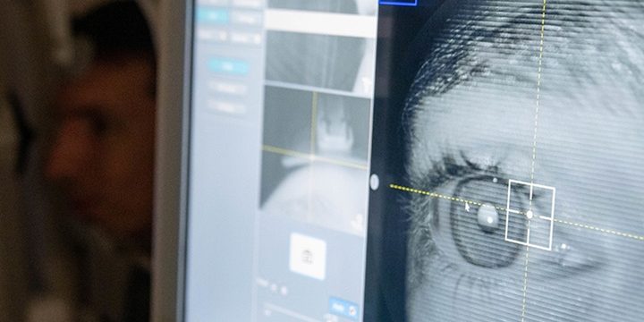 Capt. Dominic Rentz, 15th Operational Medical Readiness Squadron optometrist, demonstrates the new retinal camera at the optometry clinic at Joint Base Pearl Harbor-Hickam, Hawaii, June 16, 2022. Optometry technicians aid in the diagnosis of eye disorders while also playing an integral part in helping patients with their eye health (credit: U.S. Air Force Airman 1st Class Makensie Cooper).